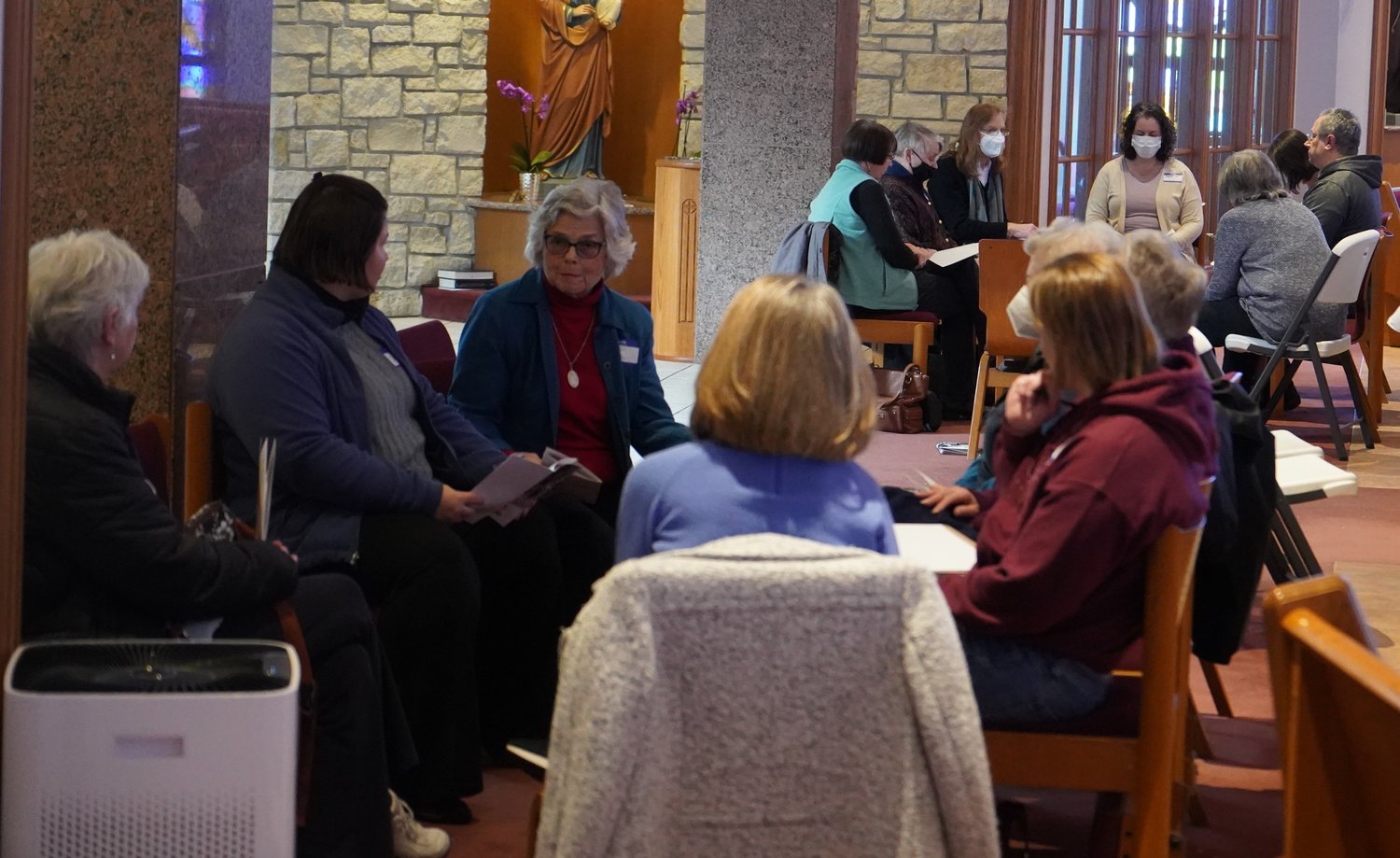 Two of the discussion groups participating in the Columbia listening session for the Synod of Bishops gather in circles in Our Lady of Lourdes Church.